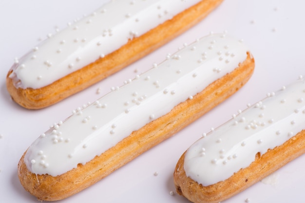 Delicious cake with icing on a white background