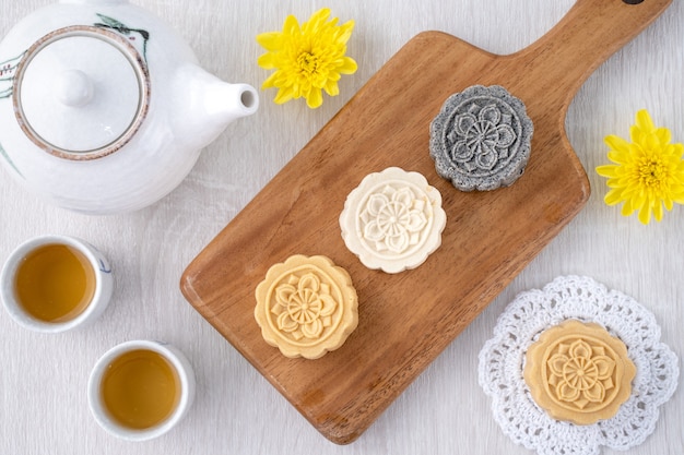 Delicious cakes on a wooden cutting board