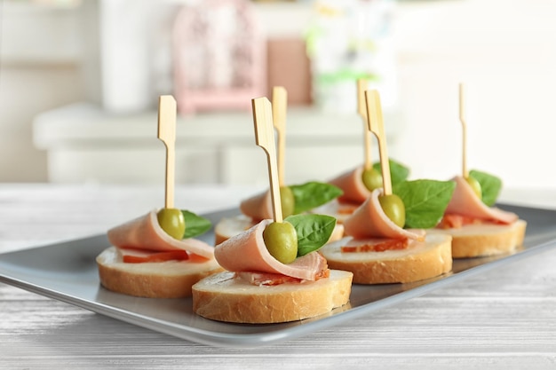 Photo delicious canapes for baby shower on plate