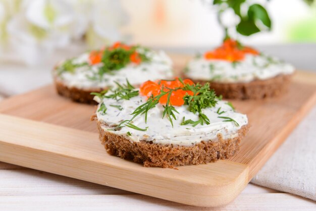 Delicious canapes on table closeup