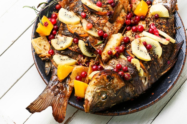 Delicious carp grilled with kiwi and mango