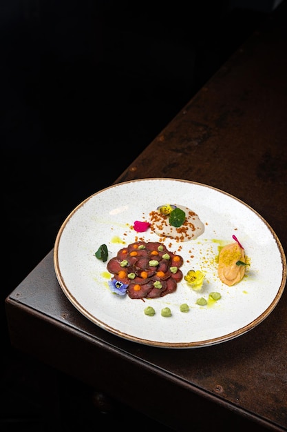 delicious carpaccio on a plate in a restaurant