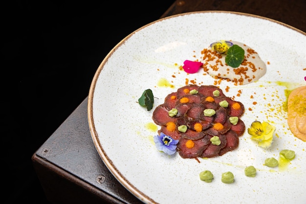 delicious carpaccio on a plate in a restaurant