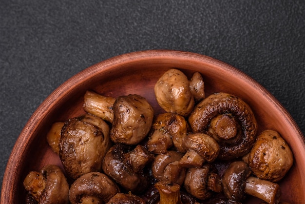 Delicious champignon mushrooms with salt spices and herbs