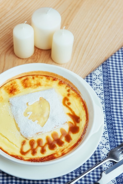 Delicious cheese casserole in a ceramic pot.