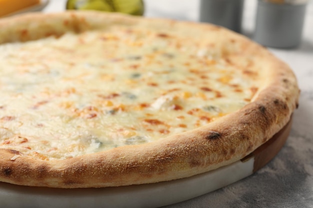 delicious cheese pizza on table closeup view