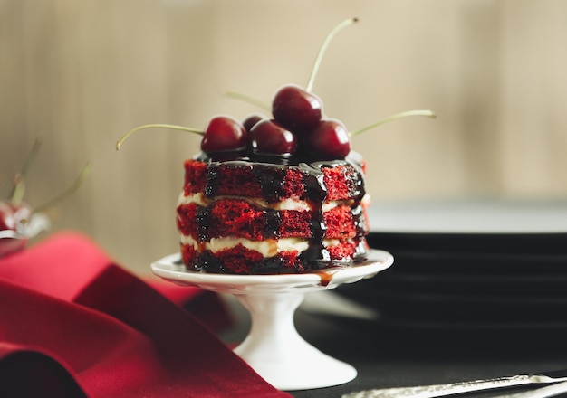 Delicious cherry cake on stand