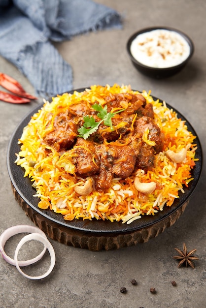 Delicious chicken biryani with ingredients