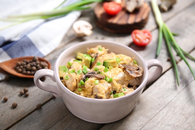 Delicious chicken casserole meal in saucepan on table