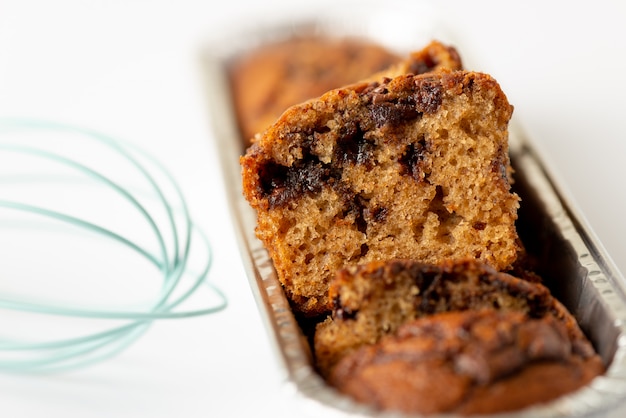 Delicious chocolate banana cake on white background. Selective focus