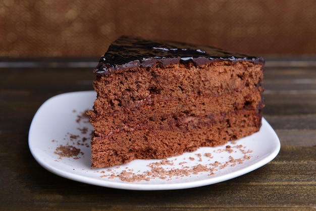 Delicious chocolate cake on table close-up