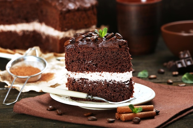 Delicious chocolate cake on table closeup