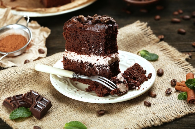 Delicious chocolate cake on table closeup