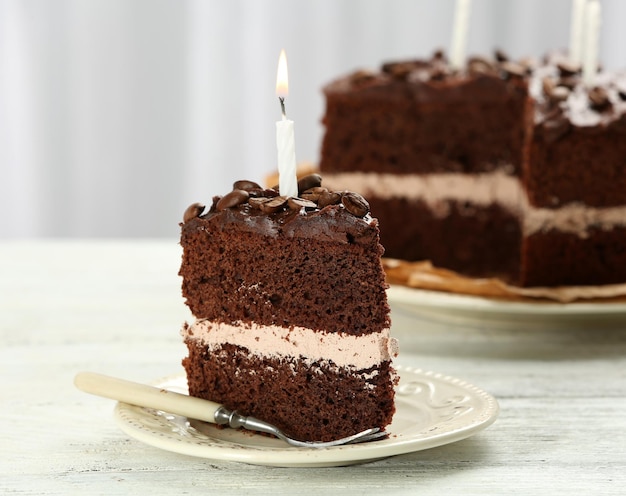 Delicious chocolate cake on table on light background