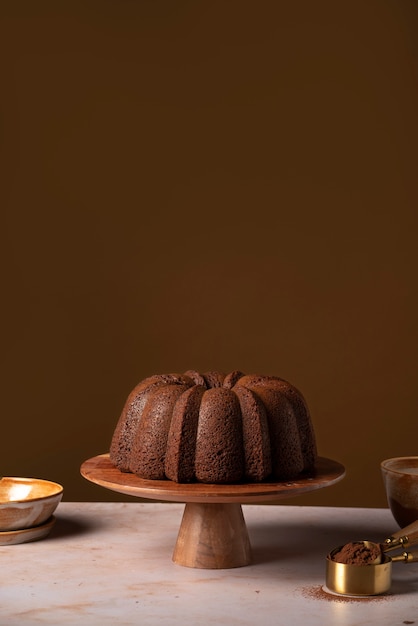 Delicious chocolate cake on wooden stand