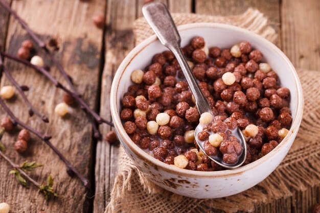 Delicious chocolate corn balls in milk.Healthy Breakfast.