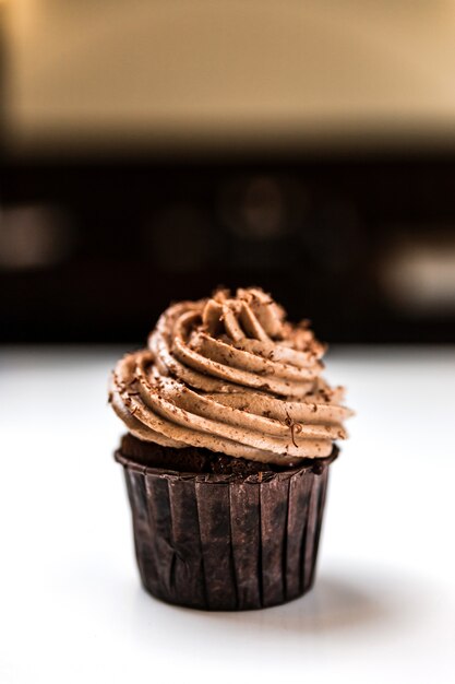 A delicious chocolate cupcake with cream