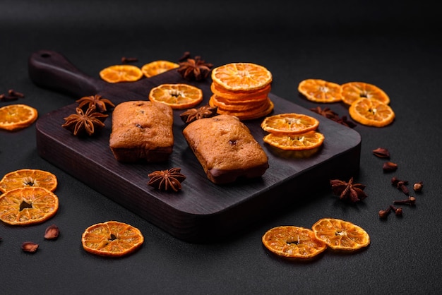 Delicious chocolate muffins and dried round shaped slices of tangerine