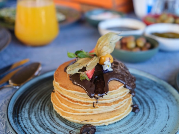 Delicious chocolate pancakes on plate