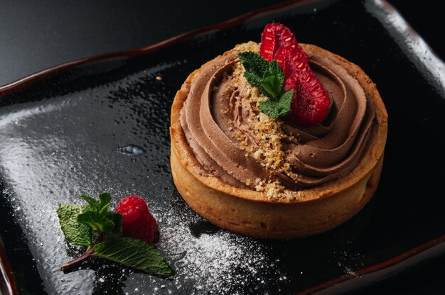 Delicious chocolate tart with raspberry