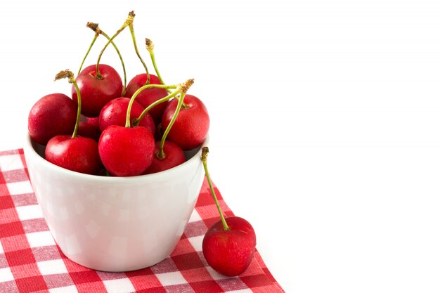 Delicious chocolate tartlets with one cherry and coconut isolated