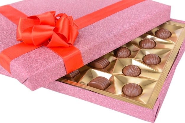 Delicious chocolates in box close-up