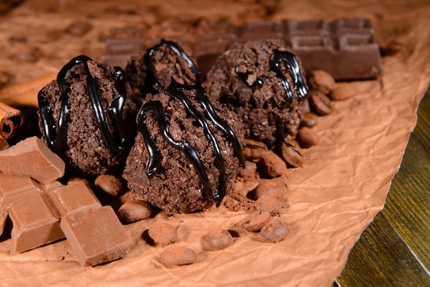 Delicious chocolates on table close-up