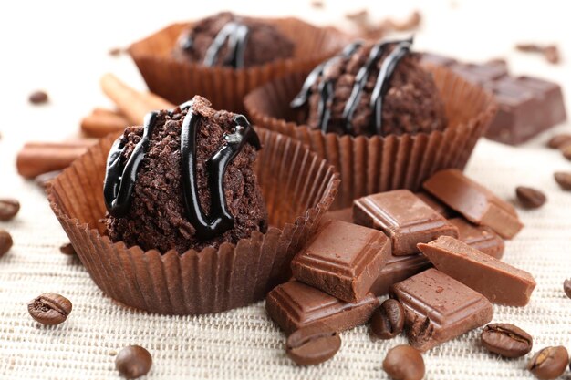 Delicious chocolates on table close-up