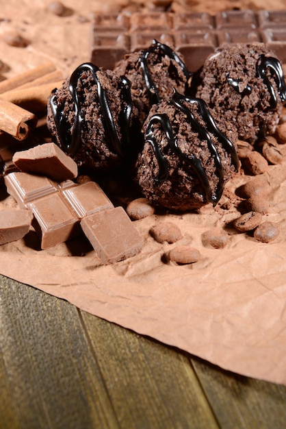 Delicious chocolates on table close-up