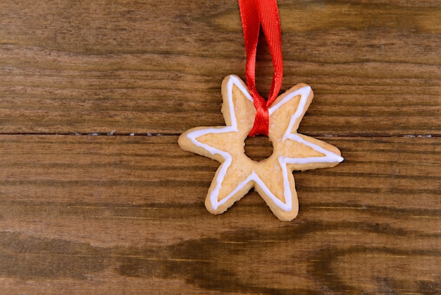 Delicious Christmas cookie on wooden background