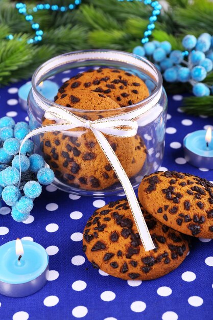 Delicious Christmas cookies in jar on table close-up