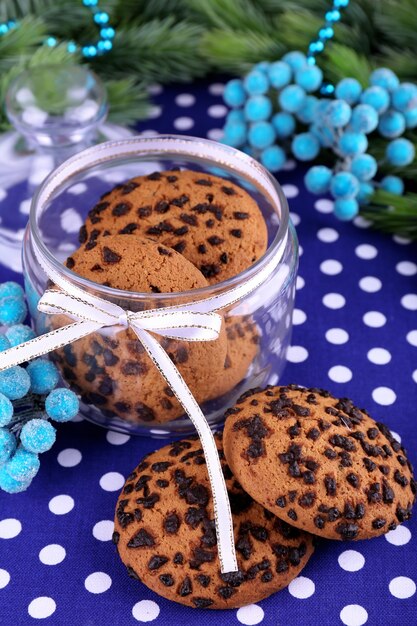 Delicious Christmas cookies in jar on table close-up