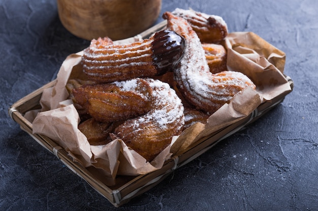 Delicious churros sticks deep fried and dusted with powdered sugar