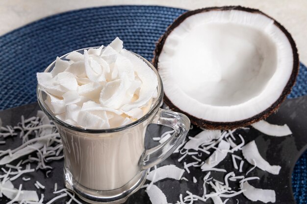 Delicious coconut mousse in glass cup.