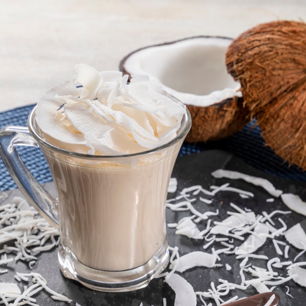 Delicious coconut mousse in glass cup.