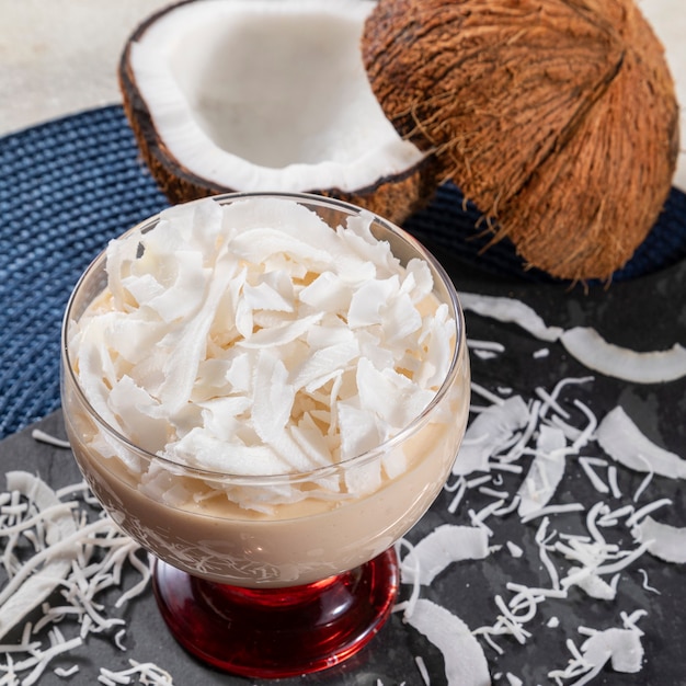 Delicious coconut mousse in glass cup.