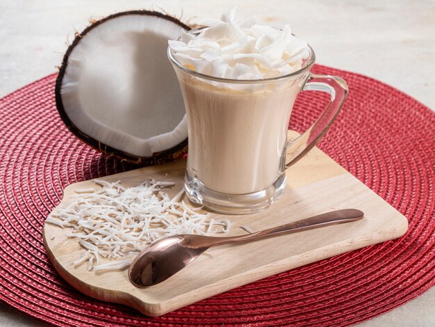 Delicious coconut mousse in glass cup.