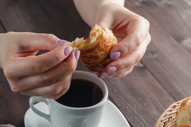 Delicious coffee with croissant