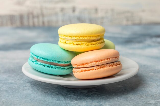 Delicious colorful cookies macarons on the plate