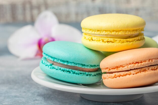 Delicious colorful cookies macarons on the plate