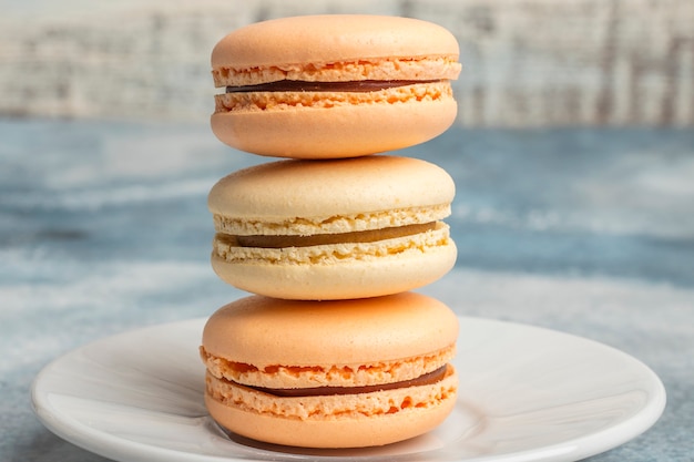 Delicious colorful cookies macarons on the plate