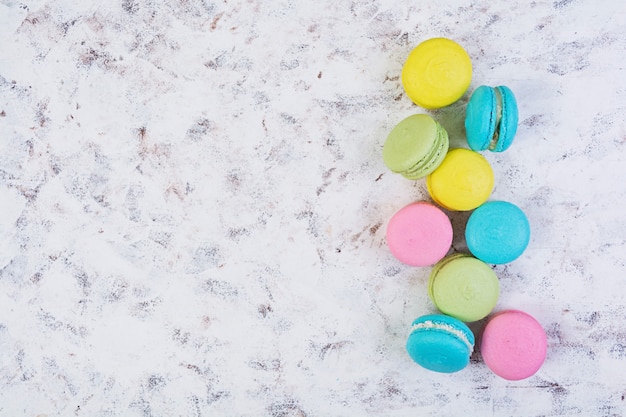 Delicious colorful macaron cakes on wooden 