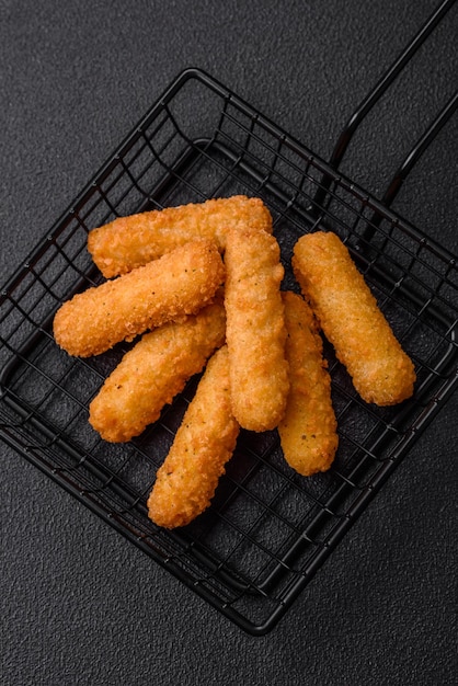 Delicious crispy cheese sticks with mozzarella salt and spices breaded and fried in oil Fast food takeaway