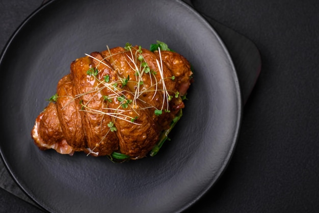 Delicious crispy croissant with salmon lettuce cheese and tomatoes