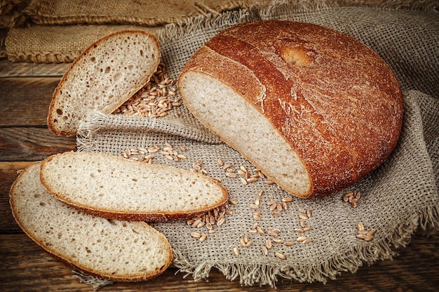 Delicious crispy sliced fresh bread on burlap napkin