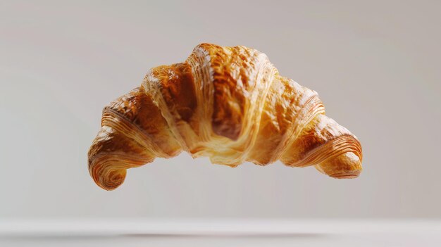 Photo delicious croissant midfall suspended in the air with a clean background