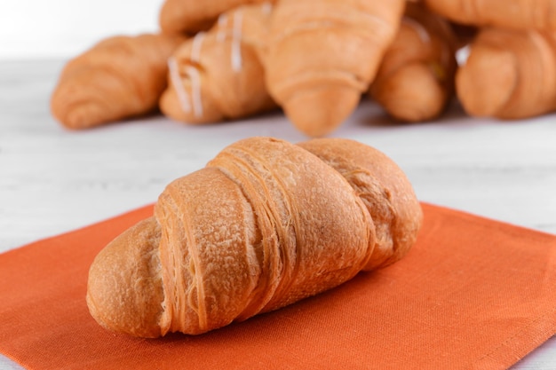 Delicious croissants on table closeup