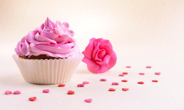 Delicious cupcake on beige background