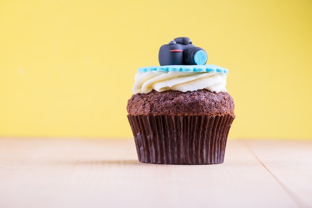 Delicious cupcake on table