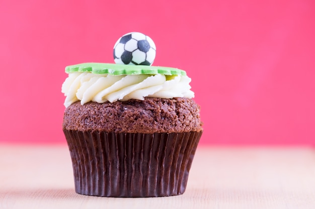 Delicious cupcake on table